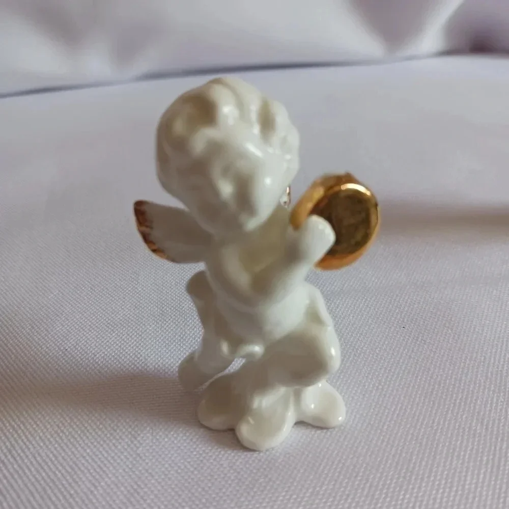 Bone china set of 4 angels gathered playing instruments